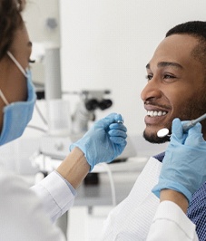 Man visiting his Horsham dentist for teeth whitening consultation