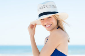 Woman at beach smiling
